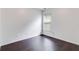 Simple bedroom with dark hardwood floors and window at 5501 Somer Ridge Ct, Douglasville, GA 30134