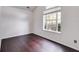 Spacious bedroom with dark hardwood floors and large window at 5501 Somer Ridge Ct, Douglasville, GA 30134