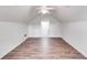 Large bonus room with hardwood floors and ceiling fan at 5501 Somer Ridge Ct, Douglasville, GA 30134