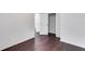 Well-lit bedroom with hardwood floors and door to hallway at 5501 Somer Ridge Ct, Douglasville, GA 30134