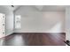 Spacious bedroom with dark hardwood floors and a window with blinds at 5501 Somer Ridge Ct, Douglasville, GA 30134