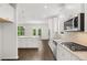 Modern kitchen featuring stainless steel appliances and an island at 1698 Lacebark Elm Way, Lawrenceville, GA 30045
