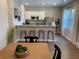 Modern kitchen with stainless steel appliances and breakfast bar at 1698 Lacebark Elm Way, Lawrenceville, GA 30045