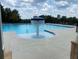 Refreshing community pool with a water feature at 1698 Lacebark Elm Way, Lawrenceville, GA 30045