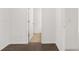 Bright hallway with hardwood floors and access to bedrooms at 1698 Lacebark Elm Way, Lawrenceville, GA 30045