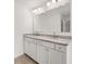 Double vanity bathroom with granite countertop at 1698 Lacebark Elm Way, Lawrenceville, GA 30045