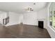 Living room featuring hardwood floors and a fireplace at 1698 Lacebark Elm Way, Lawrenceville, GA 30045