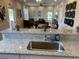 Granite countertops and stainless steel sink in the kitchen at 1698 Lacebark Elm Way, Lawrenceville, GA 30045