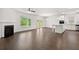 Open concept living area with kitchen, dining, and living room at 1698 Lacebark Elm Way, Lawrenceville, GA 30045