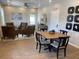 Community gathering space with seating and dining area at 1698 Lacebark Elm Way, Lawrenceville, GA 30045