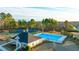 Community pool, tennis courts, and clubhouse at 1698 Lacebark Elm Way, Lawrenceville, GA 30045