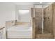 Bathroom with soaking tub and walk-in shower at 1698 Lacebark Elm Way, Lawrenceville, GA 30045