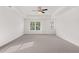 Bright bedroom with ceiling fan and carpet at 1698 Lacebark Elm Way, Lawrenceville, GA 30045