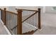 Elegant staircase with wood and metal railing at 1698 Lacebark Elm Way, Lawrenceville, GA 30045