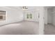 Spacious bedroom with carpeted floor and large window at 1698 Lacebark Elm Way, Lawrenceville, GA 30045