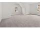 Spacious bedroom with carpeted floor and large window at 1698 Lacebark Elm Way, Lawrenceville, GA 30045