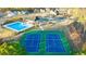 Two community tennis courts with surrounding landscape at 1698 Lacebark Elm Way, Lawrenceville, GA 30045