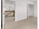 Bedroom with carpet and access to the upstairs hallway at 1698 Lacebark Elm Way, Lawrenceville, GA 30045