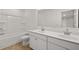 Clean bathroom with double vanity and shower/tub combo at 1698 Lacebark Elm Way, Lawrenceville, GA 30045