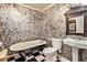 Bathroom with pedestal sink, clawfoot tub, and black and white checkered floor at 2841 Upper Sweetwater Se Trl, White, GA 30184