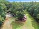 Aerial view of property showing house and outbuildings at 2841 Upper Sweetwater Se Trl, White, GA 30184