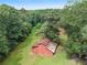 Aerial view of property with barn and wooded area at 2841 Upper Sweetwater Se Trl, White, GA 30184