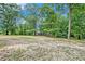 Large backyard with mature trees and open space at 2841 Upper Sweetwater Se Trl, White, GA 30184