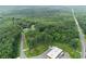 Aerial view of property showing home and wooded area at 2841 Upper Sweetwater Se Trl, White, GA 30184
