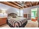 Main bedroom with a large bed and access to bathroom at 2841 Upper Sweetwater Se Trl, White, GA 30184