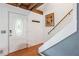 Bright entryway with hardwood floors, a staircase, and a stained-glass door at 2841 Upper Sweetwater Se Trl, White, GA 30184