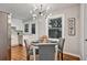 Bright dining area with a table for four and a modern chandelier at 163 Glenrose Sw Cir, Atlanta, GA 30354