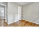 Well-lit bedroom, hardwood floors, and access to bathroom at 163 Glenrose Sw Cir, Atlanta, GA 30354