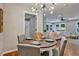 Dining area features round table and view to living room and kitchen at 163 Glenrose Sw Cir, Atlanta, GA 30354