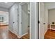 Hardwood floor hallway with access to bedrooms at 163 Glenrose Sw Cir, Atlanta, GA 30354