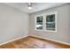 Spacious bedroom featuring hardwood floors and large windows at 163 Glenrose Sw Cir, Atlanta, GA 30354