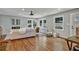 Hardwood floor living room with large windows and fireplace at 163 Glenrose Sw Cir, Atlanta, GA 30354