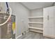 Laundry room with washer, dryer, shelving and linen cabinet at 163 Glenrose Sw Cir, Atlanta, GA 30354