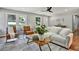 Bright living room with hardwood floors, stylish furniture, and large windows at 163 Glenrose Sw Cir, Atlanta, GA 30354