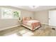 Cozy bedroom with a twin bed and large windows at 1510 Mims Sw St, Atlanta, GA 30314