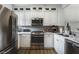 Modern kitchen featuring stainless steel appliances and white cabinets at 7112 Lunker Lake Dr # 104, Douglasville, GA 30135