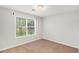 Bright bedroom with neutral walls and carpet at 112 Dillard Ct, Dallas, GA 30157