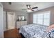 Comfortable bedroom with ceiling fan, dresser, and en-suite bathroom access at 505 Birkdale Blvd, Carrollton, GA 30116