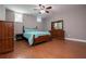 Basement bedroom with wood flooring, ceiling fan, and dresser at 505 Birkdale Blvd, Carrollton, GA 30116