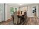 Elegant dining room featuring a large table and hardwood floors at 5365 Crow Rd, Cumming, GA 30041