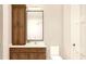 Bathroom with wood vanity, updated fixtures and large mirror at 22 Cheney St, East Point, GA 30344