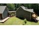 Gray house exterior with stone accents and deck at 116 Woolsey Creek, Fayetteville, GA 30215