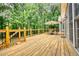 Expansive deck with wooden railings and stairs at 116 Woolsey Creek, Fayetteville, GA 30215