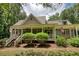 Two-story house with wraparound porch and landscaping at 116 Woolsey Creek, Fayetteville, GA 30215