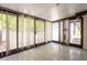 Bright sunroom with tiled floor and vertical blinds at 225 Spring Valley Se Rd, Marietta, GA 30060