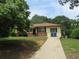 Front view of the house with walkway and yard at 1650 Bridgeport Nw Dr, Atlanta, GA 30318